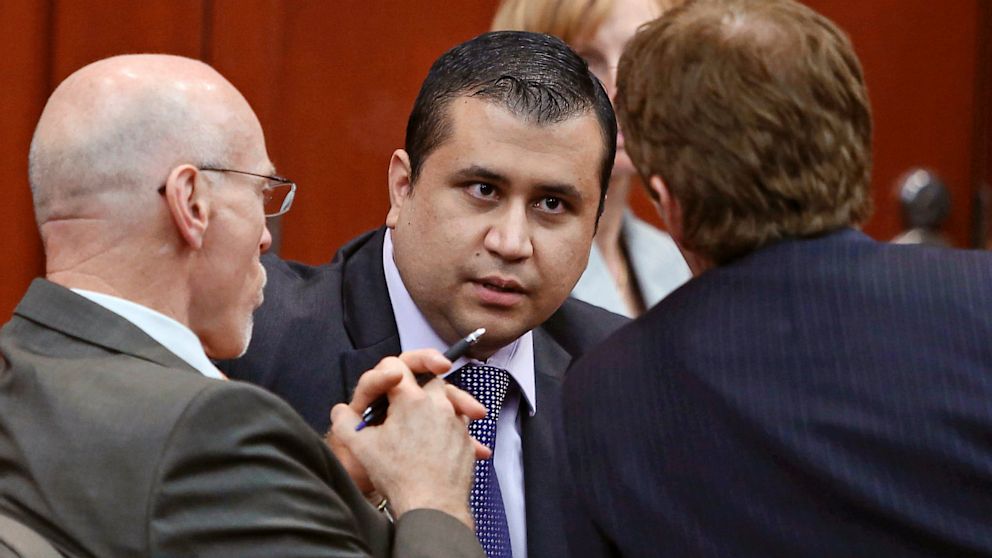 PHOTO: George Zimmerman speaks to his attorneys
