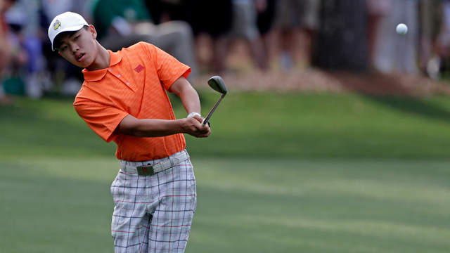PHOTO: Amateur Guan Tianlang, of China, chips to the first green during the second round of the Masters golf tournament Friday, April 12, 2013, in Augusta, Ga.