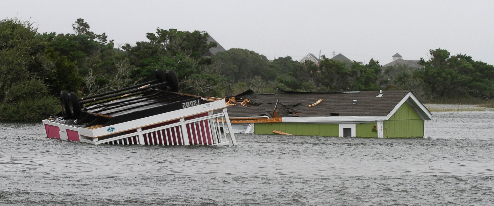 PHOTO: Two trailers sit overturned in the creek behind the Hatteras Sands Campground in Hatteras, N.C., Sept. 3, 2016 after Tropical Storm Hermine passed the Outer Banks.