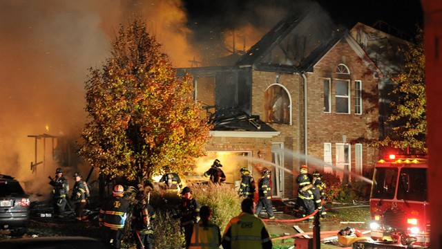 PHOTO: Firefighters work the scene where an explosion has killed two people and damaged more than a dozen homes in the Richmond Hill subdivision, Nov. 10, 2012, in Indianapolis.