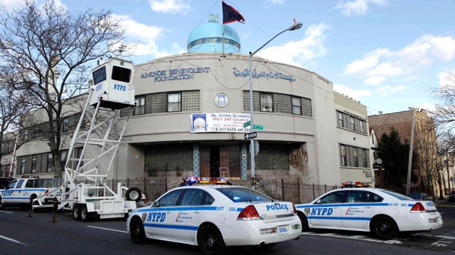 PHOTO: Police raise an overhead surveillance lift in front of the Iman al-Khoei Benevolent Foundation in New York, Jan. 2, 2012. The foundation houses an Islamic cultural center, including a school, that was attacked with a Molotov cocktail at the front o