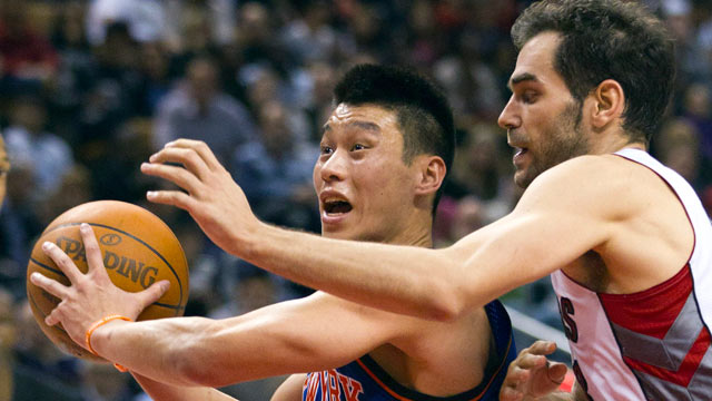PHOTO: New York Knicks guard Jeremy Lin drives past Toronto Raptors guard Jose Calderon during the second half of an NBA basketball game in Toronto, Feb. 14, 2012.
