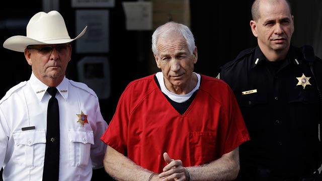 PHOTO: Former Penn State University assistant football coach Jerry Sandusky, center, is taken from the Centre County Courthouse after being sentenced in Bellefonte, Pa., Oct. 9, 2012.