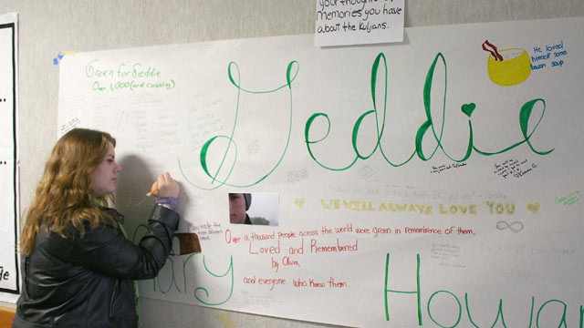 PHOTO: Arcata High School student Blaire Floyd writes on a poster memorial for fellow student Gregory Kulijan, Nov. 26, 2012, at Arcata High School in Arcata, Calif.
