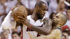 PHOTO: San Antonio Spurs guard Tony Parker (9) and Miami Heat forward LeBron James (6) collide during the second half of Game 6 of their NBA Finals basketball series, June 18, 2013 in Miami.