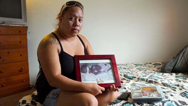 PHOTO: Leimomi Kahele holds a picture of her son Horace, who was born 15 weeks premature in 2004 and died shortly afterward,in Waialua, Hawaii. A ceramic urn holding Horace's ashes was among the items stolen Wednesday during a burglary of the Kahele's ho