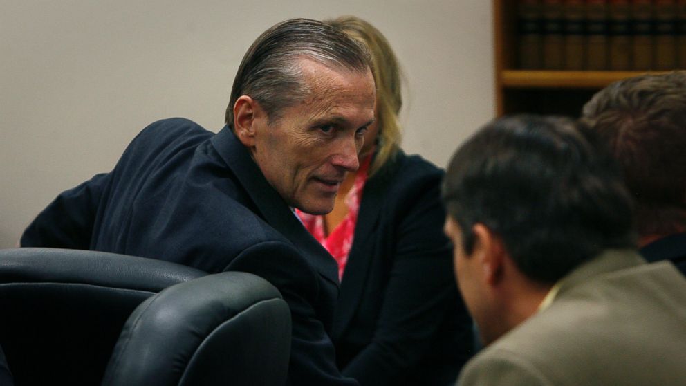 PHOTO: Martin MacNeill greets his defense team as he enters the courtroom after the jury reached a verdict. McNeill was found guilty of murder and obstruction of justice early Saturday morning, Nov. 9, 2013.