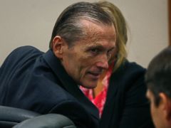 PHOTO: Martin MacNeill greets his defense team as he enters the courtroom after the jury reached a verdict. McNeill was found guilty of murder and obstruction of justice early Saturday morning, Nov. 9, 2013.