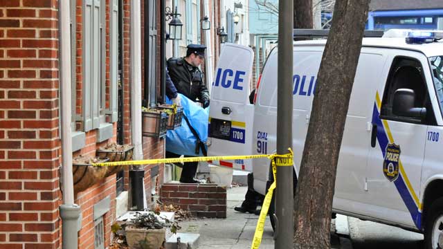 PHOTO: Police remove the body of a woman found burned to death in her basement on the 1700 block of Naudain St. in Center City, Jan. 21, 2013 in Philadelphia.