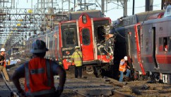 PHOTO: Emergency personnel work at the scene where two Metro North commuter trains collided, Friday, May 17, 2013 near Fairfield, Conn.