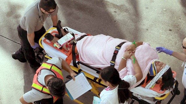 PHOTO: Emergency personnel attend to injured passengers after a bus accident at Miami International Airport on Saturday, Dec. 1, 2012 in Miami.