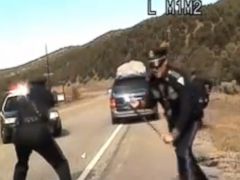 PHOTO: Three New Mexico State Police officers react as a minivan driven by motorist Oriana Farrell pulls away from a chaotic traffic stop.