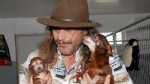 PHOTO: Dan Conne carries two of his dogs.