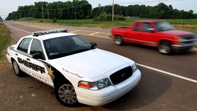 PHOTO: A DeSoto County Sheriff car patrols along Mississippi Highway 301, May 14, 2012, providing higher visibility following two recent roadway killings.