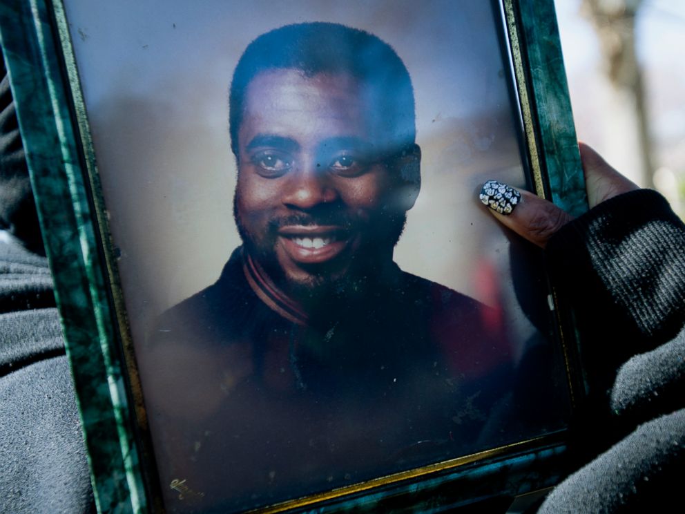 PHOTO: In this Feb. 25, 2016 photo, Kimberly Gunn holds a picture of Greg Gunn, her brother who was killed in a shooting incident, on the property where he was shot in Montgomery, Ala.
