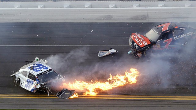 PHOTO: Kyle Larson, left, slides to a stop near Regan Smith (7) after a wreck at the conclusion of the NASCAR Nationwide Series auto race Saturday, Feb. 23, 2013, at Daytona International Speedway in Daytona Beach, Fla.