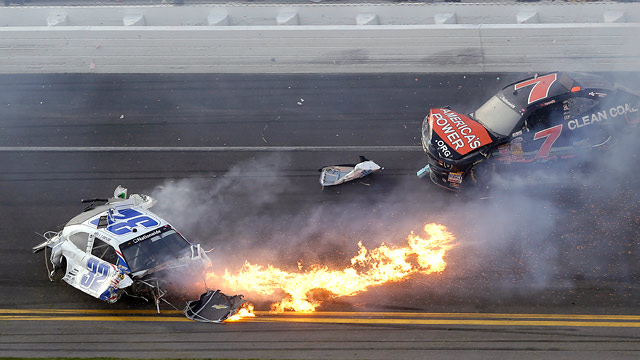 PHOTO: Kyle Larson, left, slides to a stop near Regan Smith (7) after a wreck at the conclusion of the NASCAR Nationwide Series auto race Saturday, Feb. 23, 2013, at Daytona International Speedway in Daytona Beach, Fla.