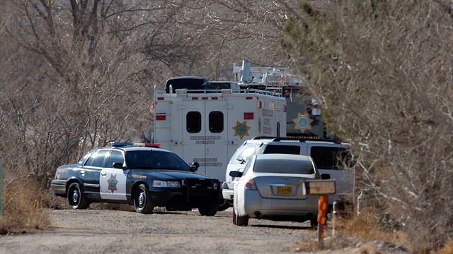 PHOTO: BCSO Deputies and crime scene personnel work the scene of a five person homicide in Albuquerque, NM, Sunday Jan. 20, 2013.