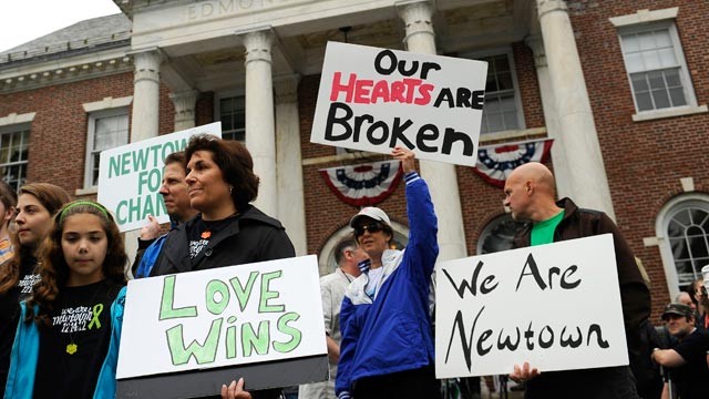 PHOTO: People gather during a ceremony, on the six-month anniversary honoring the 20 children and six adults gunned down at Sandy Hook Elementary school in December, at Edmond Town Hall in Newtown, Conn., June 14, 2013.