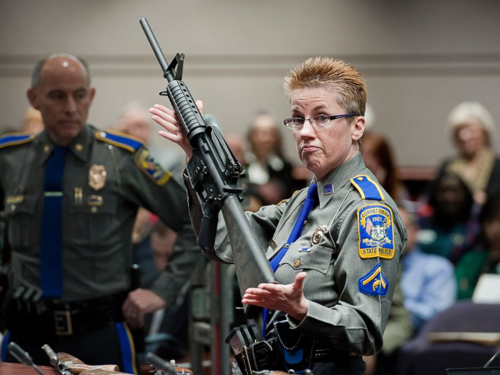 PHOTO: Detective Barbara J. Mattson of the Connecticut State Police holds up a Bushmaster AR-15-style rifle, the same make and model of gun used by Adam Lanza in the Sandy Hook School shooting in Hartford, Conn., Jan. 28, 2013.