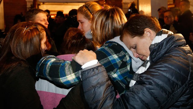 PHOTO: Girls embraces outside St. Rose of Lima Roman Catholic Church, which was filled to capacity, during a healing service held in for victims of an elementary school shooting in Newtown, Conn., Dec. 14, 2012.