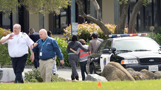 PHOTO: An unidentified group leaves Oikos University after a school shooting in Oakland, Calif., April 2, 2012.