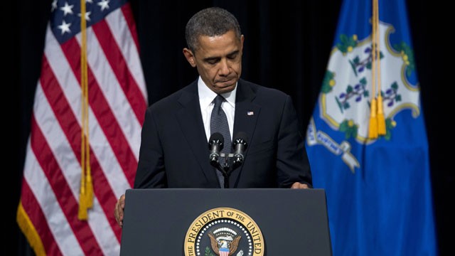 PHOTO: President Barack Obama pauses during a speech at an interfaith vigil for the victims of the Sandy Hook Elementary School shooting on Dec. 16, 2012 at Newtown High School in Newtown, Conn.