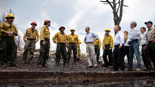 PHOTO: President Barack Obama talks with firefighters as he tours the Mountain Shadow neighborhood devastated by raging wildfires, June 29, 2012, near, Colorado Springs, Colo.