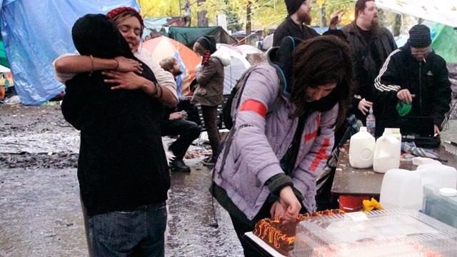 PHOTO: Protesters celebrate winning the battle to stay in the Occupy Portland Camp with hugs, cake and milk in Portland, Ore., Nov. 13, 2011.