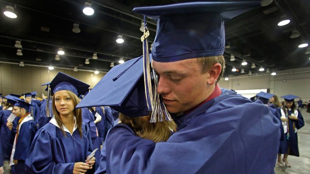 PHOTO: Southmoore High School senior Jake Spradling, hugs a classmate as they get ready to attend their commencement ceremony in Oklahoma City Saturday, May 25, 2013, five days after a tornado destroyed a large swath of their attendance area in Moore, Okl