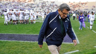 PHOTO: Penn State football coach Joe Paterno walks off the field after warm ups before Penn State's NCAA college football game in Evanston, Ill, Oct. 22, 2011.