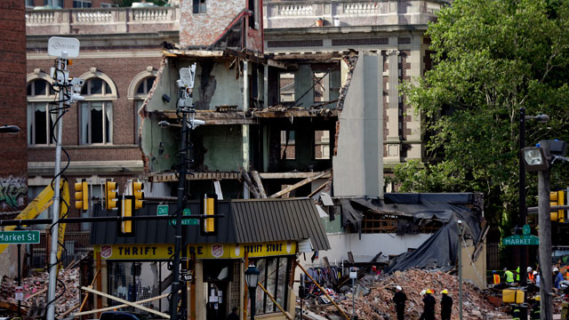 PHOTO: Firefighters view the aftermath of a building collapse, June 6, 2013, in Philadelphia.