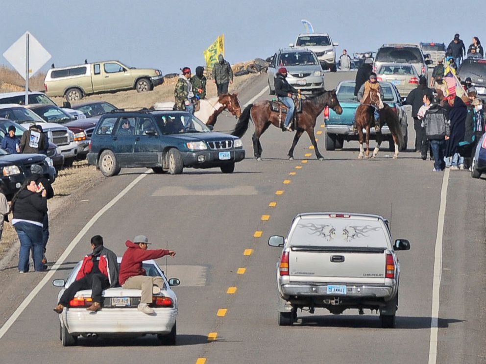 PHOTO: People protesting the Dakota Access Pipeline gather along North Dakota Highway 1806 in Morton County at the site of a new camp that was being put together, Oct. 24, 2016, in Cannonball, North Dakota.