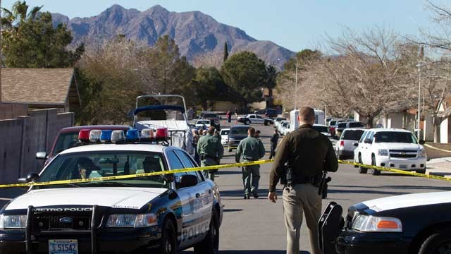PHOTO: Law enforcement officials investigate a shooting and fire in Boulder City, Nev., Jan. 21, 2013.