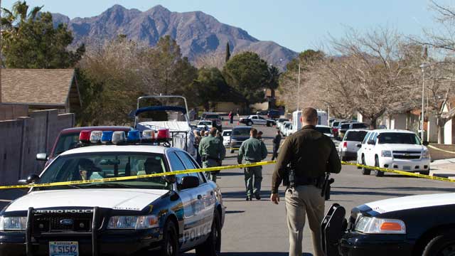 PHOTO: Law enforcement officials investigate a shooting and fire in Boulder City, Nev., Jan. 21, 2013.