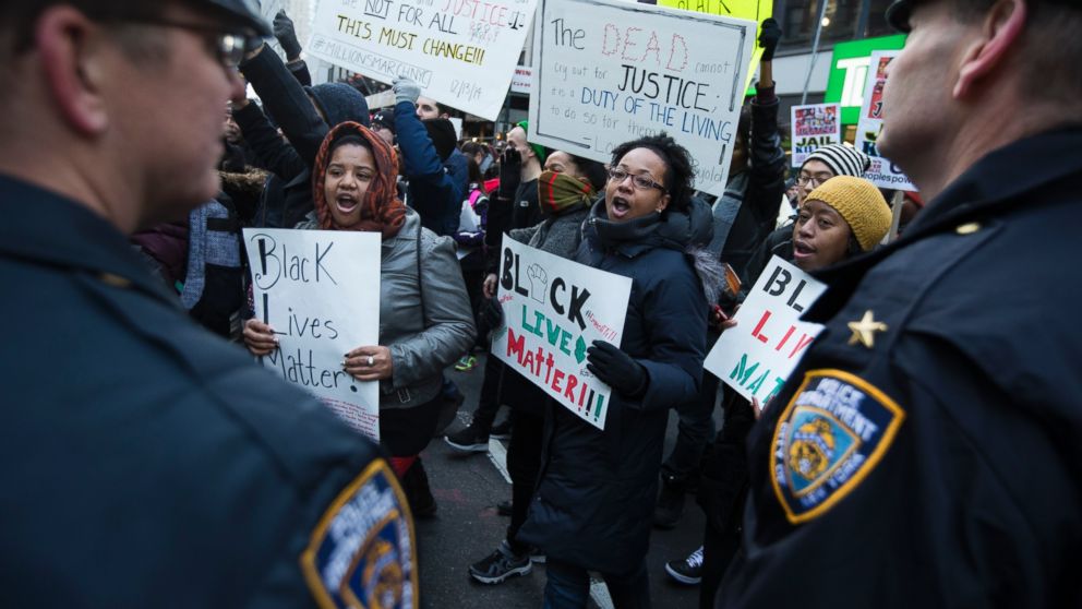 PHOTO: Demonstrators march in New York, Saturday, Dec. 13, 2014, during the Justice for All rally and march.