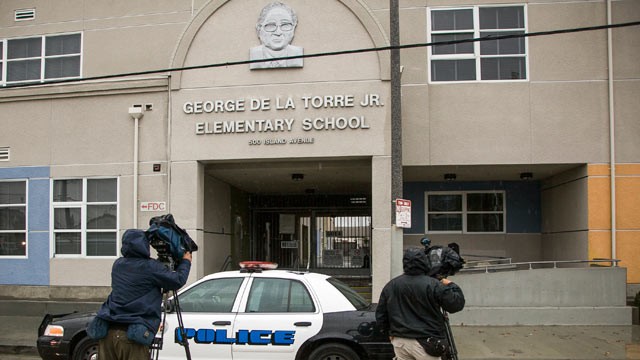 PHOTO: Television crews await outside the George De La Torre Jr. Elementary in the Wilmington area of Los Angeles, Jan. 24, 2013.