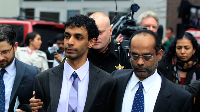 PHOTO: Dharun Ravi, center, is hugged by his father, Ravi Pazhani, right, as they leave court around noon in New Brunswick, N.J., March 16, 2012.
