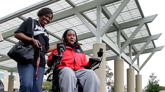PHOTO: Paralyzed Rutgers football player Eric LeGrand, right, and his mother, Karen LeGrand, leave the Kessler Institute for Rehabilitation in West Orange, N.J., Oct. 12, 2011.