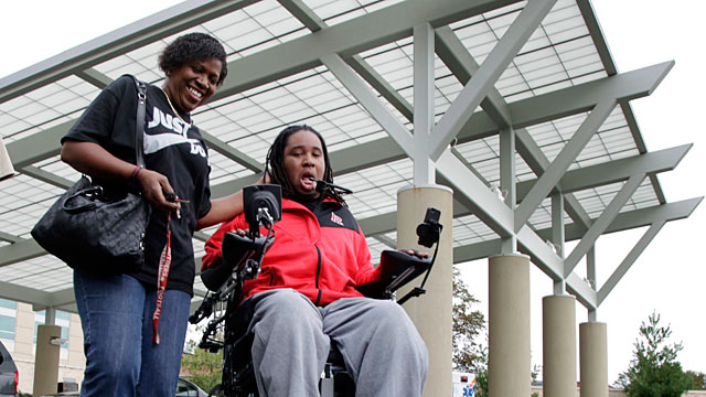 PHOTO: Paralyzed Rutgers football player Eric LeGrand, right, and his mother, Karen LeGrand, leave the Kessler Institute for Rehabilitation in West Orange, N.J., Oct. 12, 2011.