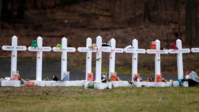 PHOTO: Crosses bearing the names of the Newtown shooting victims are displayed in the Sandy Hook village of Newtown, Conn., Saturday, Dec. 22, 2012.
