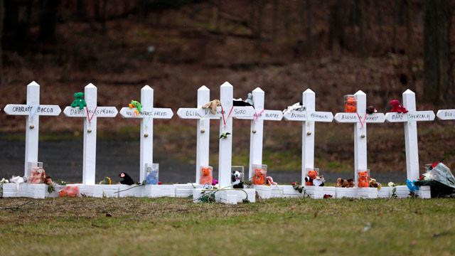 PHOTO: Crosses bearing the names of the Newtown shooting victims are displayed in the Sandy Hook village of Newtown, Conn., Saturday, Dec. 22, 2012.