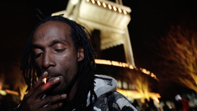 PHOTO: Allister Adams smokes marijuana, Dec. 6, 2012, just after midnight at the Space Needle in Seattle.