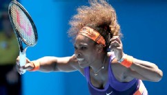 PHOTO: Serena Williams hits forehand return to compatriot Sloane Stephens during their quarterfinal match at the Australian Open tennis championship in Melbourne, Australia, Jan. 23, 2013.