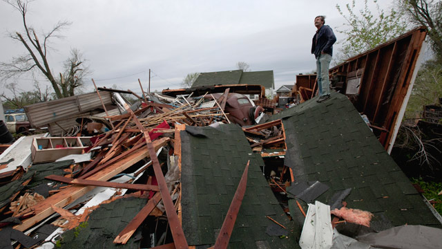 PHOTO: Gary Gladwin looks over his wrecked property where he stored a 1937 Chevy, in Thurman, Iowa, Sunday, April 15, 2012.