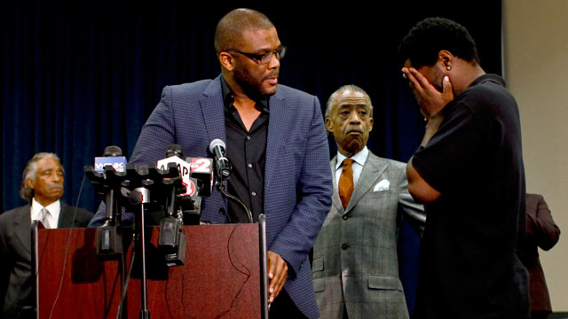 PHOTO: Filmmaker Tyler Perry, left, and the Rev. Al Sharpton, center, look on as an unidentified man comes forward during a news conference to discuss the special missing-person investigations of Terrance Williams and Felipe Santos on Jan. 10, 2013 at the