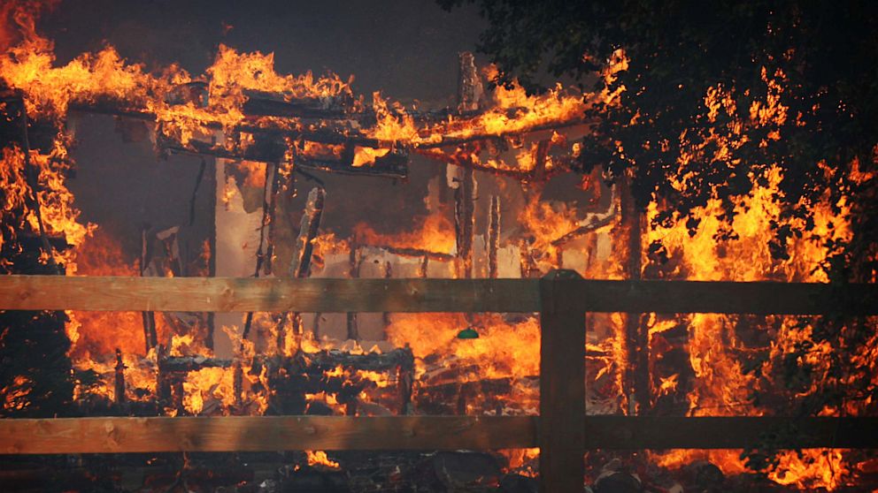 PHOTO: Multiple structures burn in the Poppet Flats area as the Silver Fire roared through the area along Hwy 243 between Banning and Idyllwild, Calif. on Wednesday, Aug. 7, 2013.