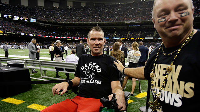 PHOTO: Former New Orleans Saints player Steve Gleason, who is suffering from ALS, is ushered onto the field before an NFL football game against the Philadelphia Eagles at the Mercedes-Benz Superdome in New Orleans, Nov. 5, 2012.