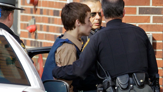 PHOTO: T.J. Lane, a suspect in the shooting of five students at Chardon High School is taken into juvenile court by Geauga County deputies in Chardon, Ohio.