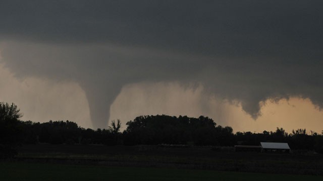 PHOTO: A tornado moves on the ground north of Solomon, Kan., on Saturday evening, April 14, 2012, with I-70 seen in the foreground.